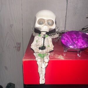 Skeleton Figurine with Green Accents